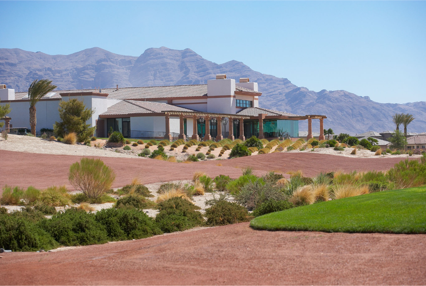 Southwest home with mountains behind